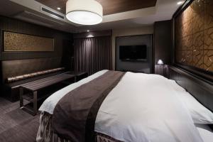 A bed or beds in a room at N Hotel