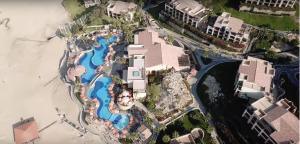 an aerial view of a resort with a pool at Suites at PB Sunset Beach Cabo San Lucas in Cabo San Lucas
