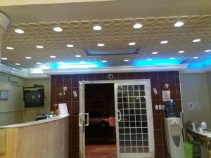 a lobby with blue lights on the ceiling at Khobar Fantastic Furnished Apartments in Al Khobar