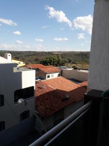 a view from the balcony of a building with red tile roofs at Cantinho da Paz in Brasília