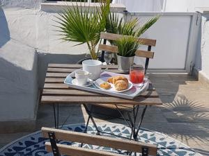 a tray of pastries on a table on a patio at Il Civico 2 in Bari