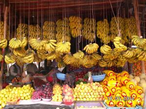 a fruit stand with bunches of bananas and other fruits at Apartment Monte Cristo in Casablanca