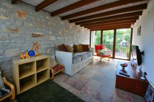 a living room with a stone wall at Villa Svetlana in Vabriga