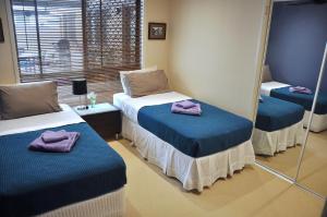 Postel nebo postele na pokoji v ubytování TL Warmest Homestay