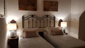 Postel nebo postele na pokoji v ubytování B&B La Sinagoga