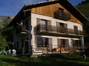 a large house with two balconies on top of it at Chalet Lou Bella Vista in Auron