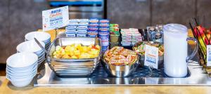 a buffet with fruit and other food on a table at ibis budget Antony Massy rénové 2024 in Antony
