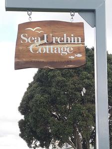 a sign for a southern california coliseum at Sea Urchin Cottage in Miranda