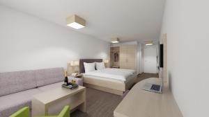Letto o letti in una camera di all inclusive Hotel Lohmann