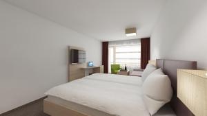 Letto o letti in una camera di all inclusive Hotel Lohmann