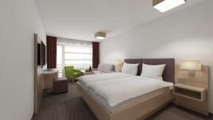 Letto o letti in una camera di all inclusive Hotel Lohmann