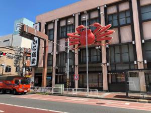 a building with a large red chinese sign in front of it at YokohamaKannai HouseBar in Yokohama