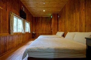 Ένα ή περισσότερα κρεβάτια σε δωμάτιο στο Hemerocallis Country House