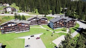 an aerial view of a resort with a lot of buildings at I dr Rehwiesa A25 in Arosa