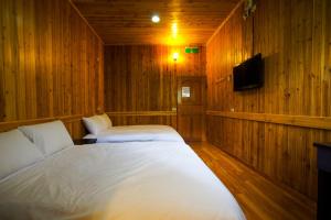 Ένα ή περισσότερα κρεβάτια σε δωμάτιο στο Hemerocallis Country House