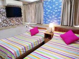 Ένα ή περισσότερα κρεβάτια σε δωμάτιο στο LongWin Hostel