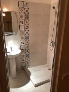 a bathroom with a shower and a sink at Guest House Hello in Kutaisi +45 photos