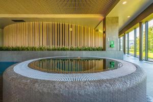 Bazén v ubytování Vilnius Grand Resort nebo v jeho okolí