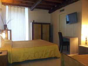 Letto o letti in una camera di Hotel Al Convento