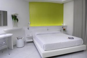 
Postel nebo postele na pokoji v ubytování Giulivo Hotel & Village
