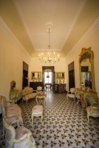 a large room with furniture and a chandelier at Villa le Torri B&B in Trapani