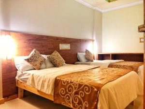 Postel nebo postele na pokoji v ubytování Mariana Maldives