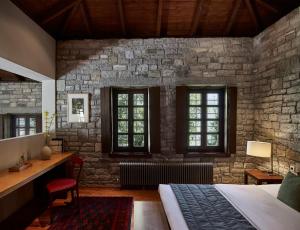 Posteľ alebo postele v izbe v ubytovaní Aristi Mountain Resort