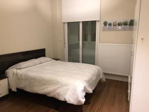Postel nebo postele na pokoji v ubytování Lugo 360