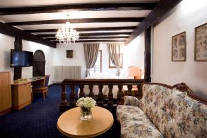 a living room with a couch and a table at Hotel Traube in Stuttgart