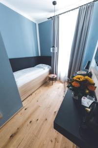 Posteľ alebo postele v izbe v ubytovaní Altstadthotel Kasererbräu