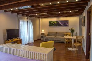 a living room with a couch and a table at Apartamento en Santa Cruz de La Palma in Santa Cruz de la Palma