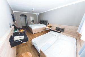 Posteľ alebo postele v izbe v ubytovaní Altstadthotel Kasererbräu