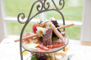a dish of food on a plate on a table at Landhaus Töpferhof bei Travemünde in Travemünde