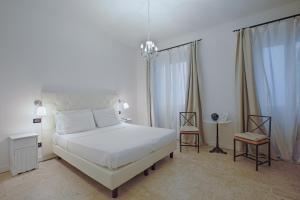 A bed or beds in a room at Badia Fiorentina