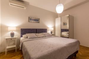 Postel nebo postele na pokoji v ubytování Split-Villas Dalmatica for 12