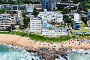 an aerial view of a beach and buildings at First Group La Montagne in Ballito