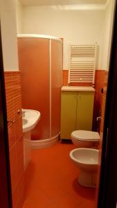 a bathroom with a toilet and a sink at centralcity in Reggio di Calabria