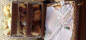 a basket filled with lots of different types of bread at Hotel Garni Jägerhof in Sigmaringen
