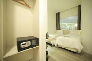 Cama o camas de una habitación en Ozone Hotel Pantai Indah Kapuk