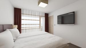 Letto o letti in una camera di all inclusive Hotel Lohmann