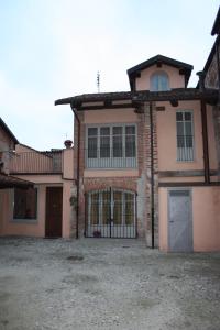 a large house with a gate in front of it at All'Imperatore in Cherasco