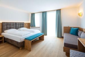 Postel nebo postele na pokoji v ubytování Hotel Blitzburg