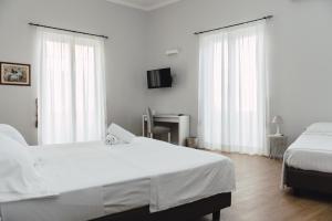 Posteľ alebo postele v izbe v ubytovaní Elysium B&B