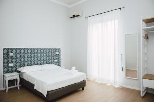 Posteľ alebo postele v izbe v ubytovaní Elysium B&B