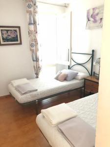 Posteľ alebo postele v izbe v ubytovaní Carrer Voramar 11