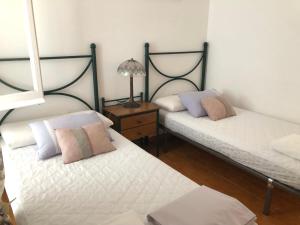 Posteľ alebo postele v izbe v ubytovaní Carrer Voramar 11