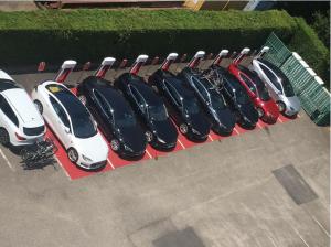 a row of cars parked in a parking lot at IBIS Lyon Sud Chasse Sur Rhône in Chasse-sur-Rhône