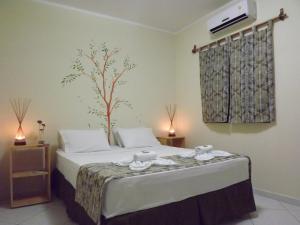 Un pat sau paturi într-o cameră la Vila Pura Vida