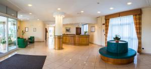 a lobby of a hospital with a waiting room at Hotel Rizzi in Castel San Giovanni