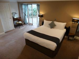 Katil atau katil-katil dalam bilik di Cantley House Hotel - Wokingham